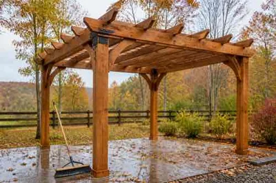Pergola prepared for fall weather with secure drainage and hardware