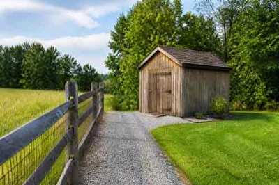 Shed set back from a property boundary with access space