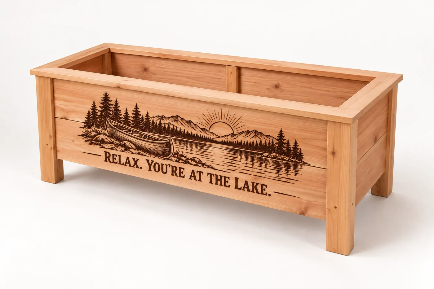 Canoe and lakeside sunset engraving on a small rectangular cedar planter