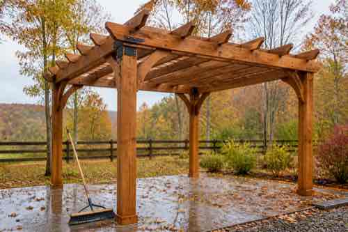 Pergola prepared for fall weather with secure drainage and hardware